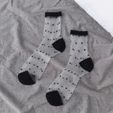Sheer socks with black polka dots