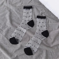 Sheer socks with black polka dots