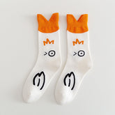 White winking-goose crew socks with orange V-shaped cuffs and black bird artwork