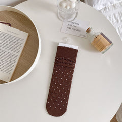 Coffee polka dot sock with pale dots and a broad ribbed cuff, laid flat