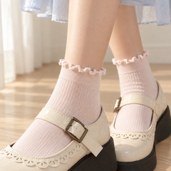 AI close styling illustration of the soft matching curled cuffs and fine closed ribs of Blush Pink short socks