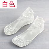 Pair of White low-cut socks with large floral lace motifs, fine mesh feet and shaped lace openings