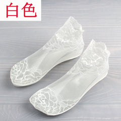 Pair of White low-cut socks with large floral lace motifs, fine mesh feet and shaped lace openings