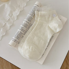 Milk White ankle socks with diamond-like knit texture, white flower-button detail and mesh frills