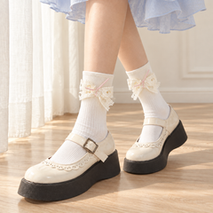 AI styling illustration of Milky White ribbed socks with heart-lace bows and pale-pink ribbon above Mary Jane shoes