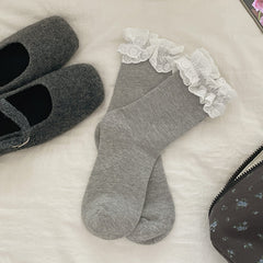 Gray crew socks with white heart-patterned lace cuffs, selected one-pair option