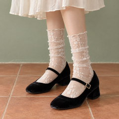AI styling illustration of White sheer floral socks with small same-color sprigs and narrow rolled rims, worn with black velvet Mary Janes and an ivory skirt