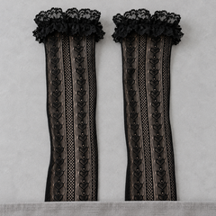 AI product illustration of Black long linked-heart mesh shafts and broad scalloped lace cuffs on a gray surface, with lower ends concealed.
