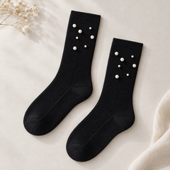 AI product illustration of an empty matching Black fine-rib pair with plain cuffs and seven scattered pearl-style beads on each visible upper panel.