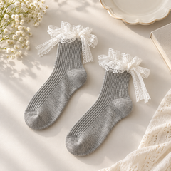 AI overhead product illustration of an empty Gray fine-rib pair with White lace cuff bows and long openwork lace tails.
