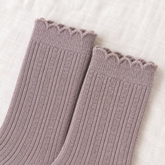 AI product detail of Heather Taupe sock openings with narrow wavy edges, a subtle upper band and fine vertical ribs on off-white linen.