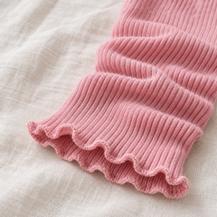 AI detail illustration of the small lettuce lower opening on a Pink footless ribbed leg warmer.