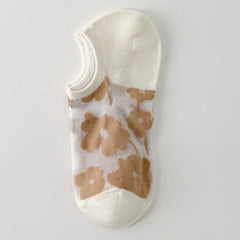 Caramel large-flower sheer liner sock with a white opening, toe and heel, shown as a single color sample