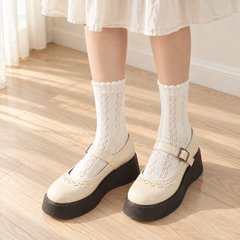AI higher-front outfit illustration of Milky White leaf-eyelet socks with an ivory skirt and cream shoes