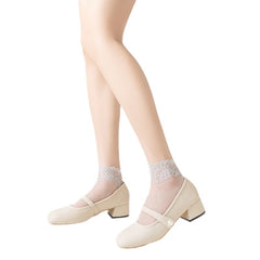 White sheer ankle socks with leaf-lace cuffs styled with cream Mary Jane shoes