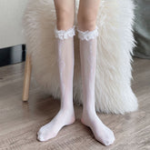 White mesh socks with linked outline hearts and crossed links down the front, finished with white lace and bows