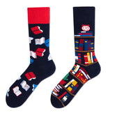 Coordinated mismatched sock pair showing scattered books on one sock and a bookshelf on the other