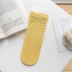 Yellow openwork socks with rippled cuff edges