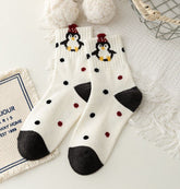 Penguin Dots crew socks with penguin characters, black and red dots, and dark heels and toes