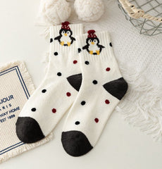 Penguin Dots crew socks with penguin characters, black and red dots, and dark heels and toes