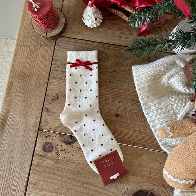 Milk White crew sock with red polka dots, a red bow and a red stripe below the cuff