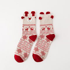 Reindeer A crew socks with red-and-cream patterned bands and raised reindeer cuff details