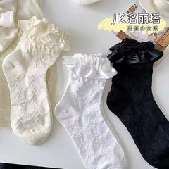 Group photo of Black, White and Milky White ribbon-bow lace socks; quantity 1 is one pair of the selected color