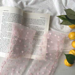 Scattered heart sheer crew-style socks in the selected Pink color