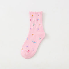 Pink crew sock with colorful planets, crescent moons and stars