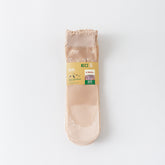 Light Nude sheer ankle socks with small white bow motifs, shown with original supplier packaging