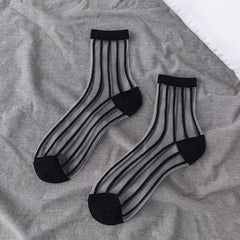 Sheer socks with black vertical stripes
