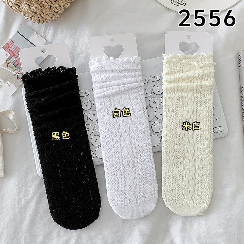 Black, White and Cream cable-pattern mesh socks displayed side by side with color labels