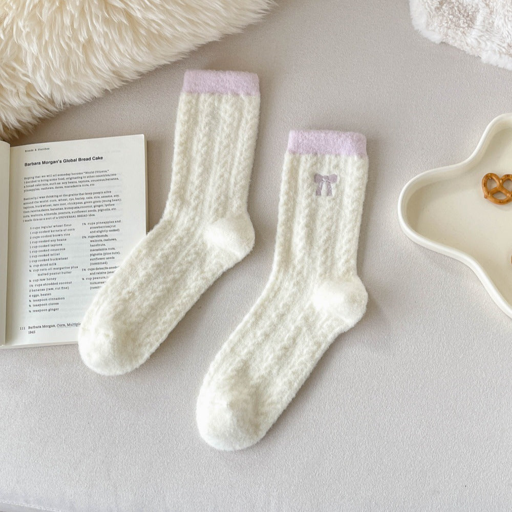 Pink Trim cream crew socks with fuzzy diamond texture, pink cuffs and embroidered bow in a flat lay