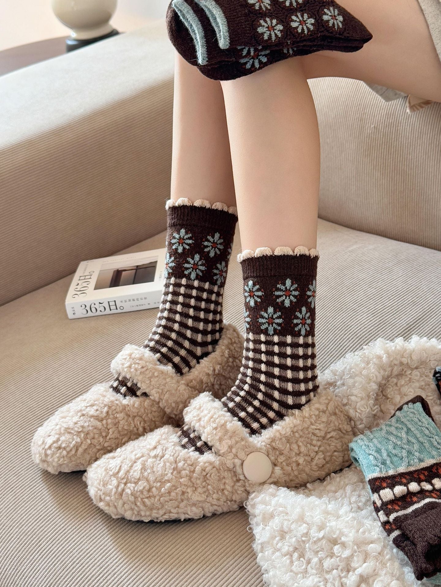 Check style brown socks with pale blue flowers above cream-and-brown checkerboard bands