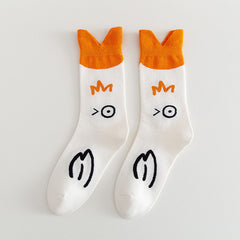 White winking-goose crew socks with orange V-shaped cuffs and black bird artwork