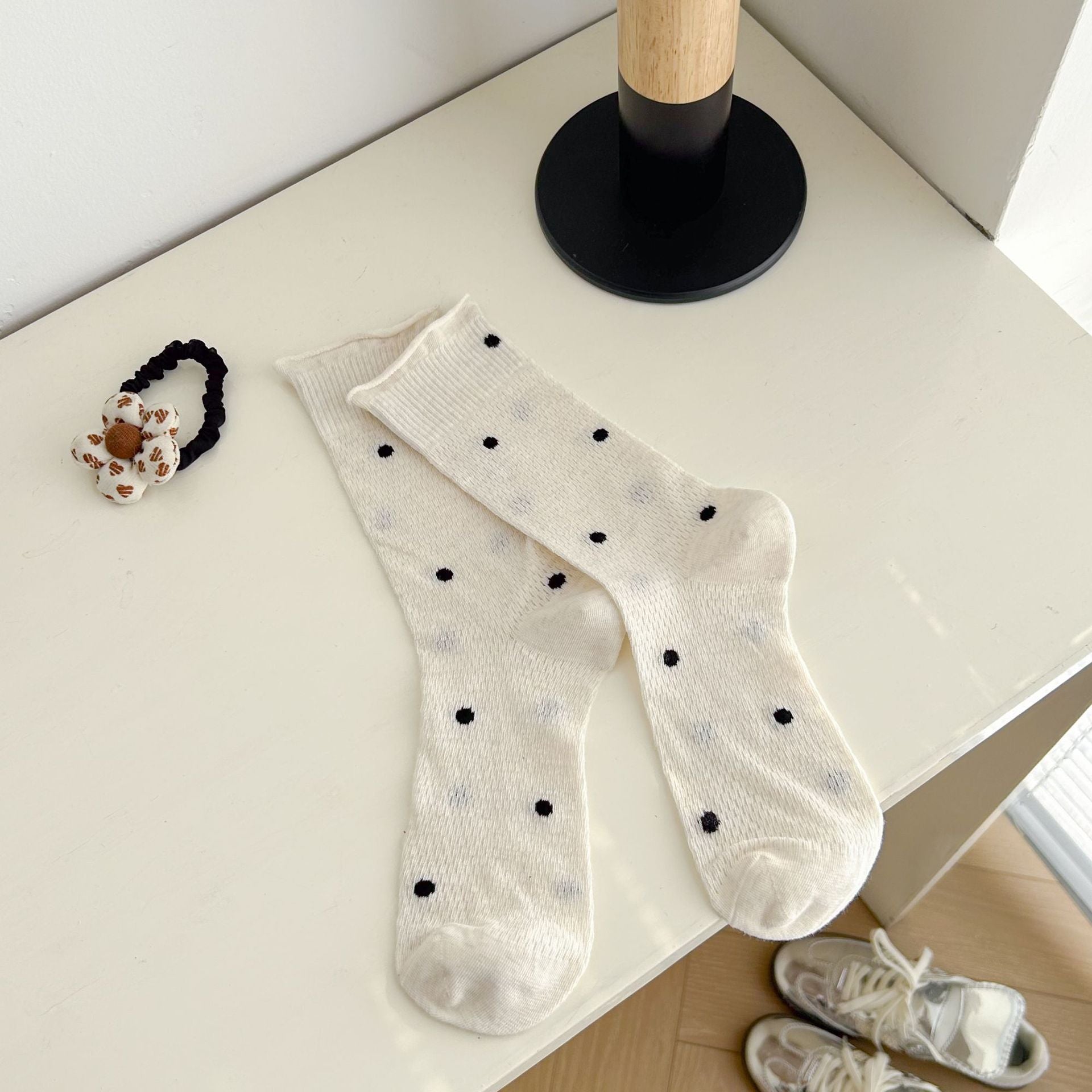Beige dotted socks with rolled cuff edges