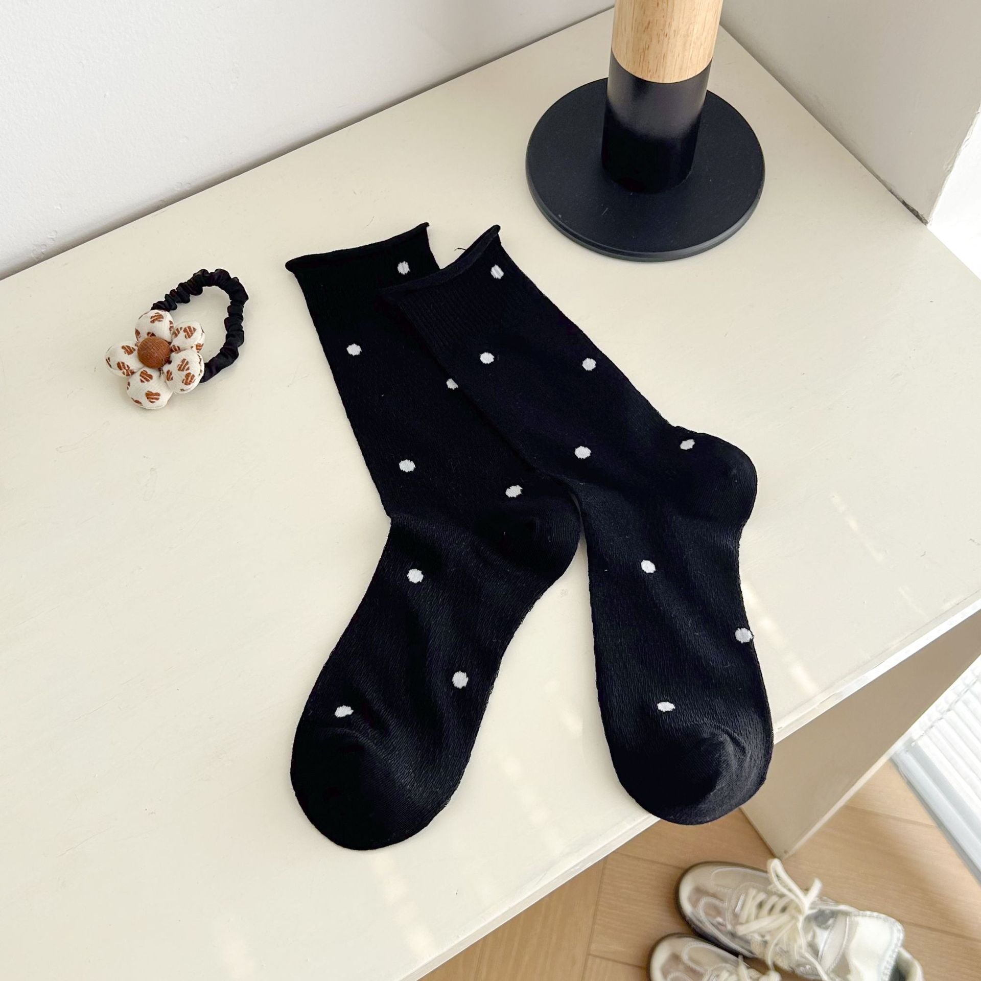 Black dotted socks with rolled cuff edges