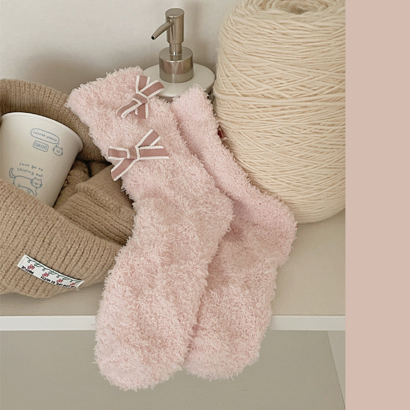 Light Pink fuzzy-looking crew socks with pale-edged ribbon bows