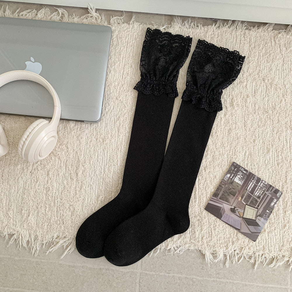 Black long socks with broad gathered floral lace cuffs and a smaller frill