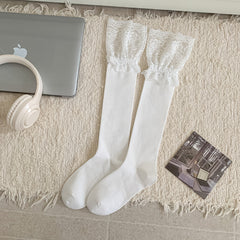 White long socks laid flat with broad gathered floral lace cuffs and plain bodies