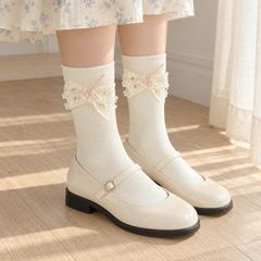 AI oblique outfit view showing the straight cuffs and localized heart-lace bows on Milky White socks