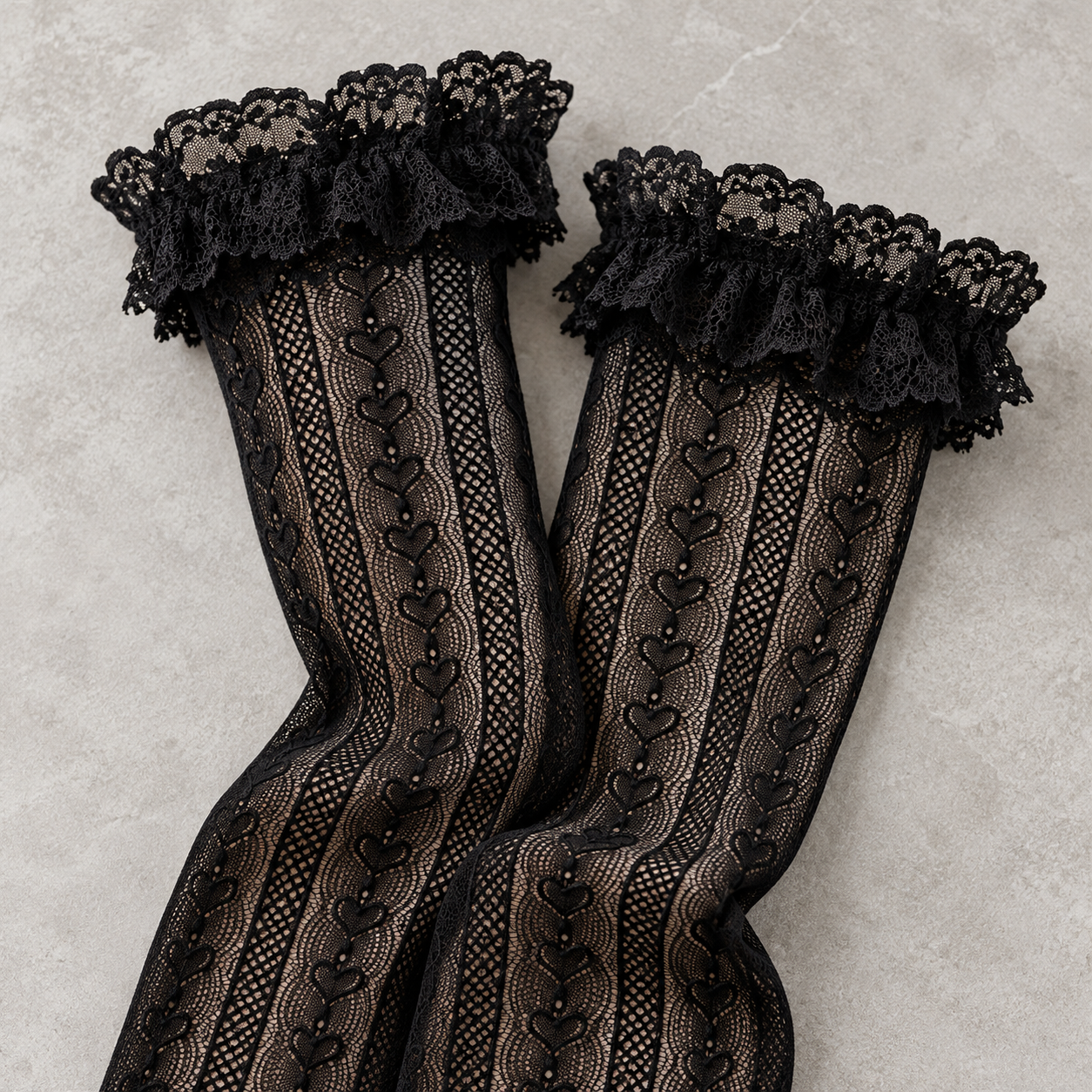 AI product illustration of gently folded Black heart-link mesh front panels and broad floral lace openings.