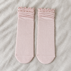 AI front-facing flatlay illustration of one Light Pink sock pair with softly rolled upper sections, waved rims and plain rounded toes