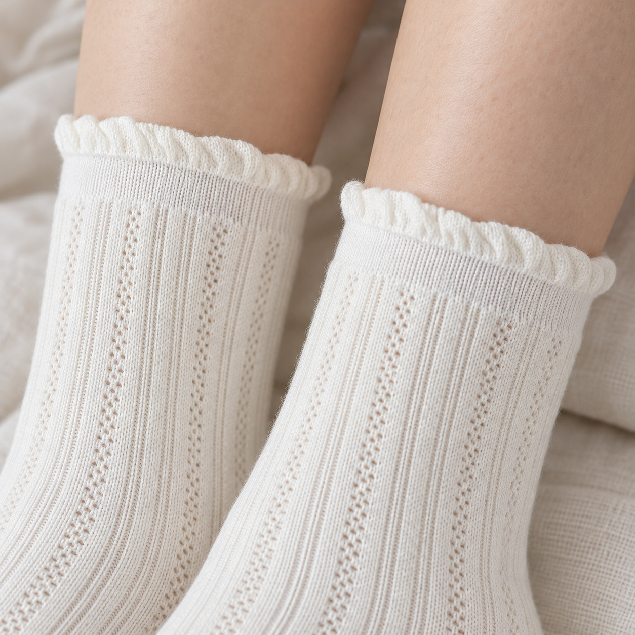 AI close illustration of the small waved rims and narrow smooth upper bands of White fine-pointelle socks