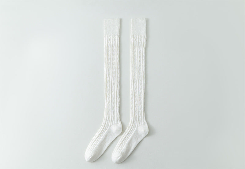 Untouched supplier reference of one Cream long-sock pair with narrow cable columns, plain straight upper bands and same-color feet.