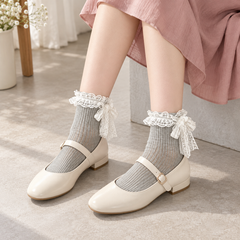 AI seated outfit illustration of Gray fine-rib White lace-bow socks with ivory Mary Janes and a muted rose skirt.