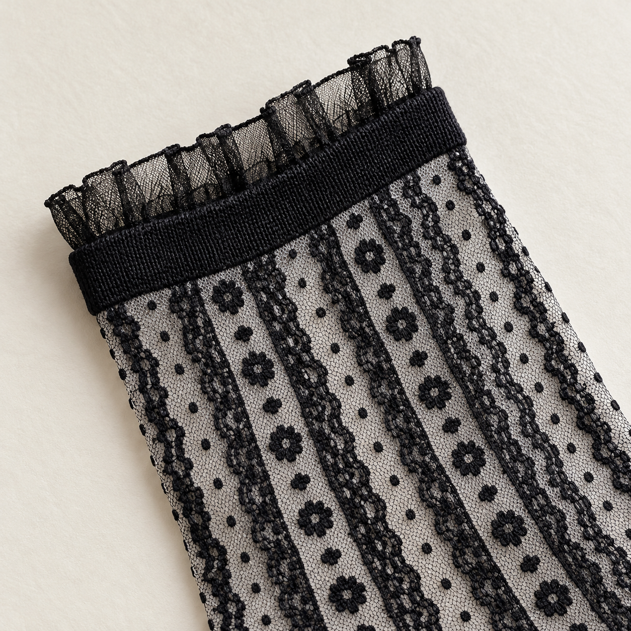 AI product detail illustration of the short translucent cuff frill, opaque band and small vertical flower-chain stripes on the Black socks.