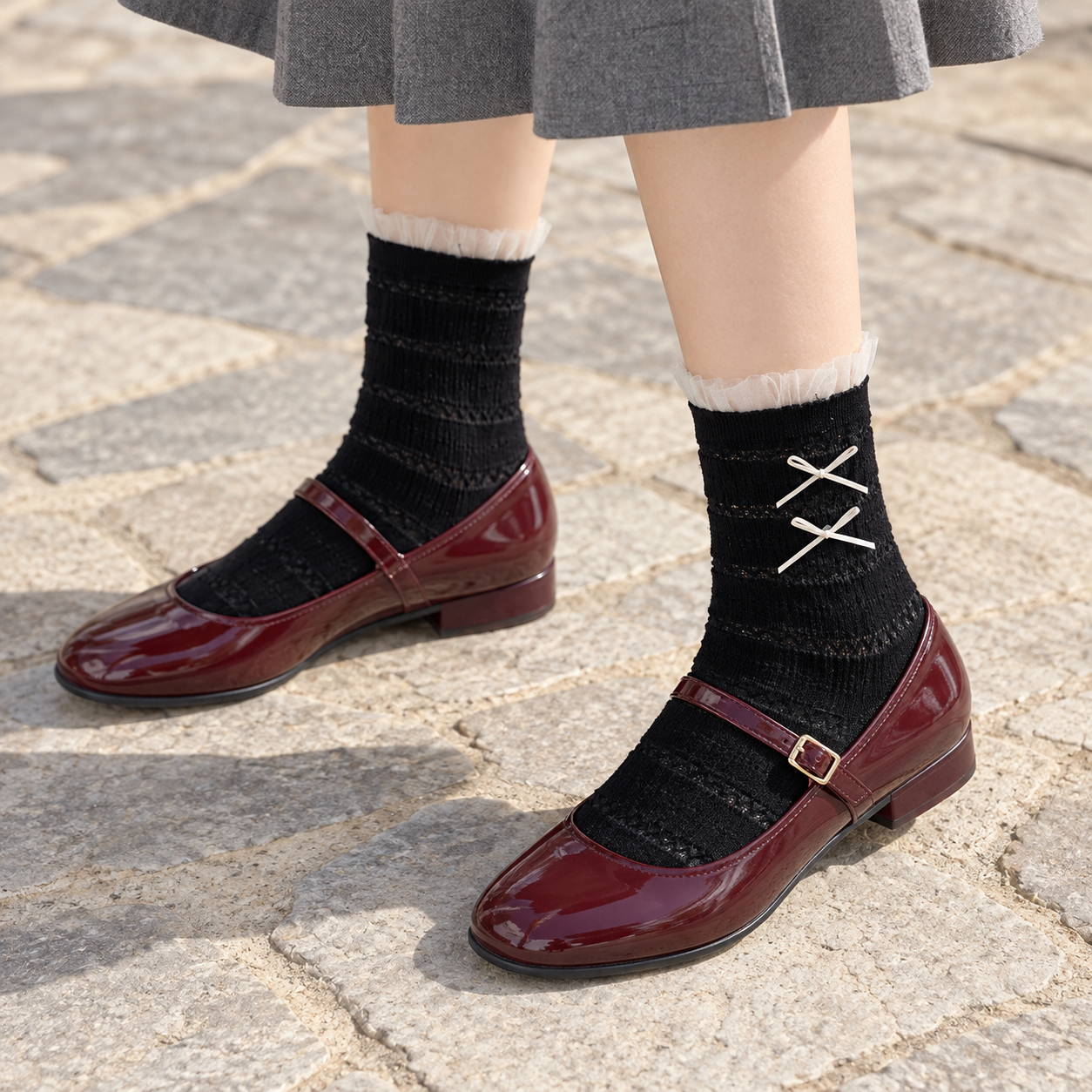 AI high-angle styling illustration of Black tulle-cuff bow socks with burgundy Mary Janes on pale stone paving.