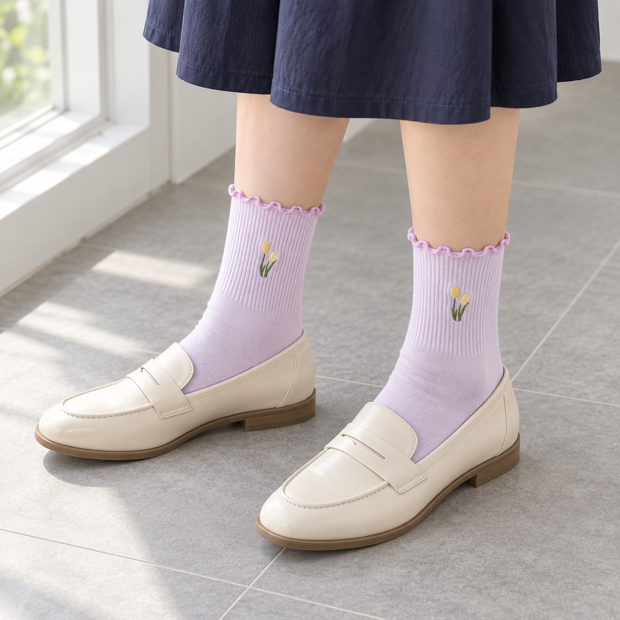 AI window styling illustration of Lavender tulip ribbed socks with cream loafers and a navy skirt on gray tile.