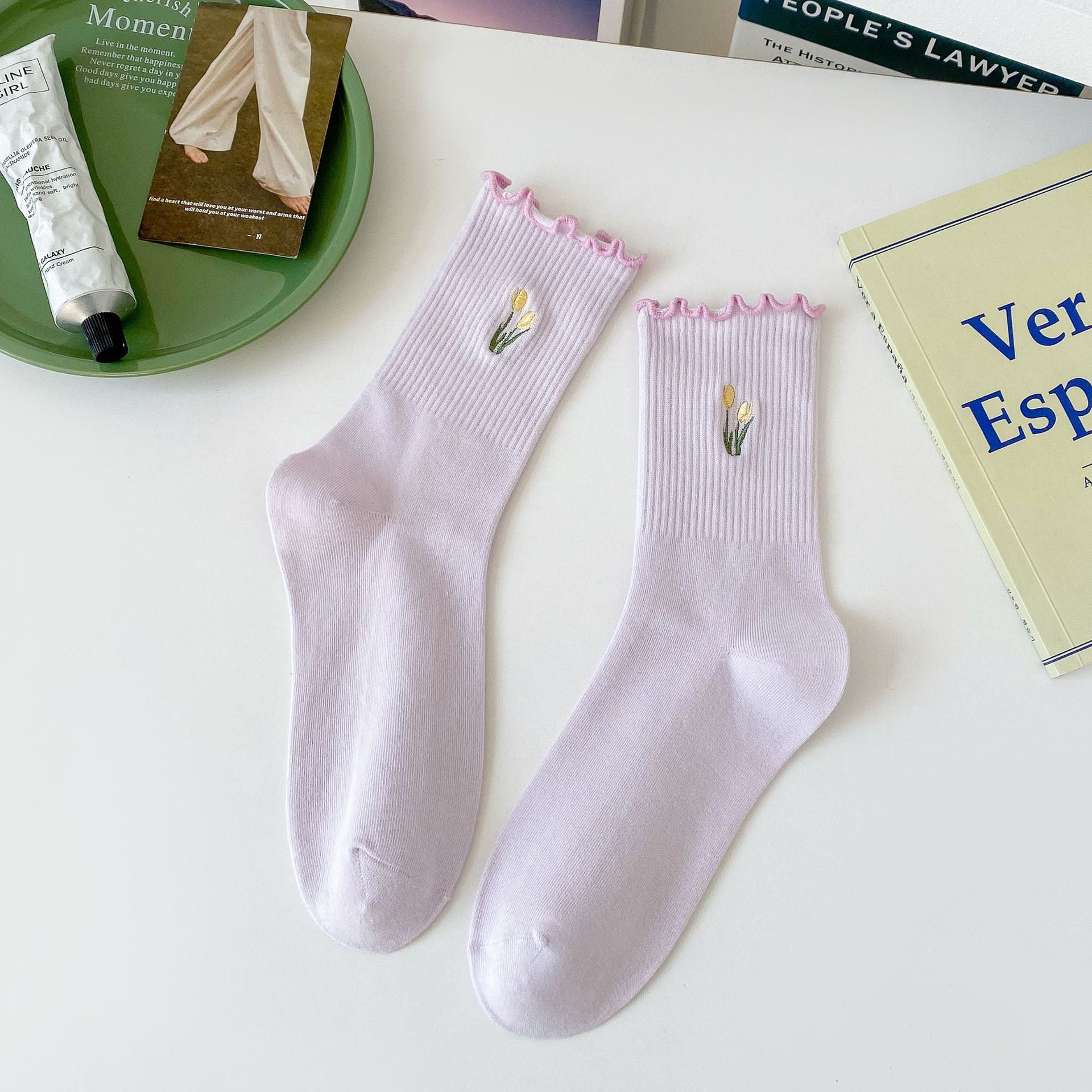 Untouched original reference of a Lavender fine-rib sock pair with pink-purple wavy edges and small two-yellow-tulip embroidery clusters.